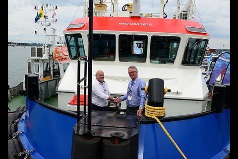 Casper Vermuelen of Damen shakes hands with John Spencer of GPS on the purchase of the new Shoalbuster 2709